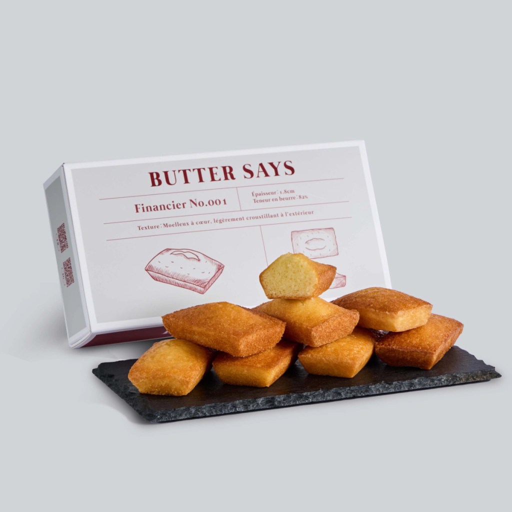 ButterSays品牌人氣代表作「艾許奶油費南雪禮盒」（8入／售價690元），選用日本北海道江別製粉搭配法國艾許奶油製作，經高溫烘焙後散發迷人的焦化奶油香氣，成為品牌最具代表性的明星商品。(圖／ ButterSays 提供)